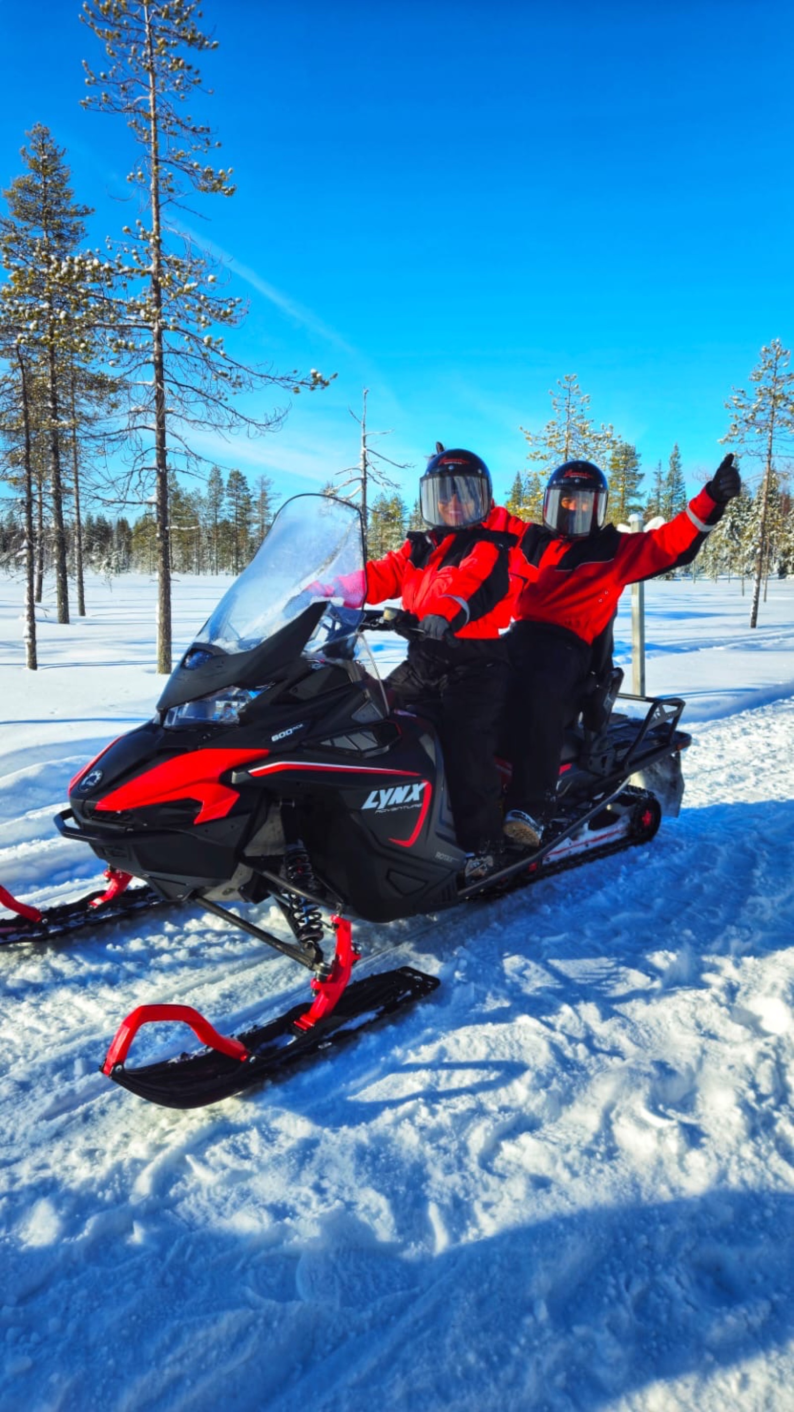 Snowmobile safari across a frozen lake in Rovaniemi
